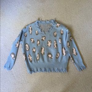 Blue, gray, and pink ripped on the edges sweater